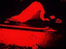 Shrouded Figure at Coffin